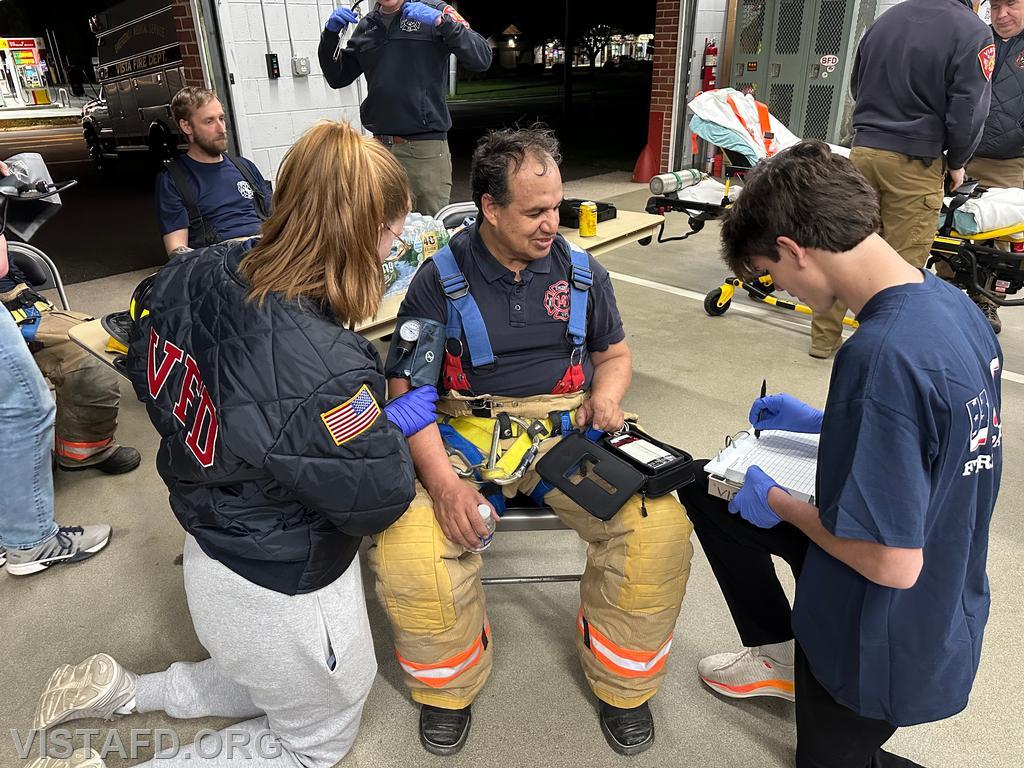 Foreman Isabel Fry and Probationary Firefighter/EMT Candidate Ashtin Rama conducting &quot;Rehab Operations&quot; on Firefighter Martin Rojas – 04/14/25