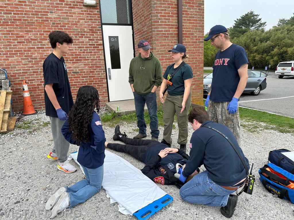 Lt. Elly Hersam demonstrating how to move a patient during &quot;Module 3 – EMS Scene Operations&quot; – 05/04/25