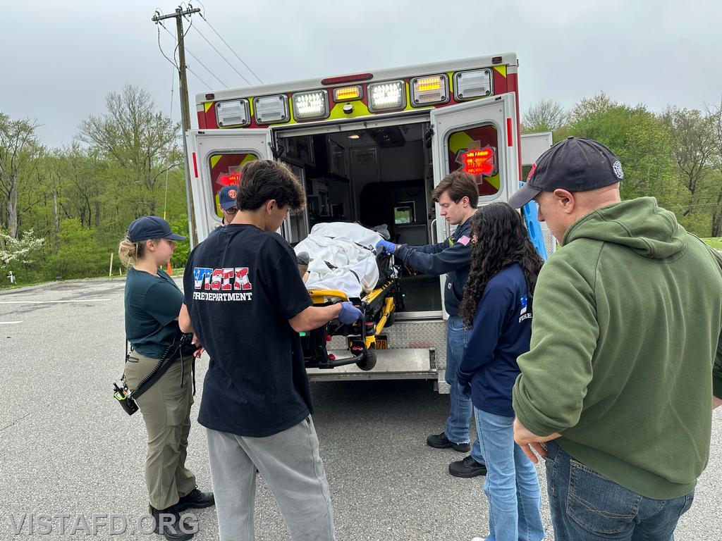 Vista EMS personnel reviewing how to load a patient into the ambulance during &quot;Module 3 – EMS Scene Operations&quot; – 05/04/25