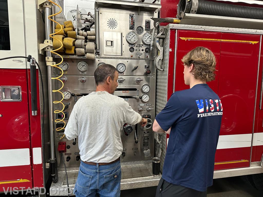Firefighter Phil Katz going over pump operations with Firefighter/EMT Ben Bo - 06/08/25