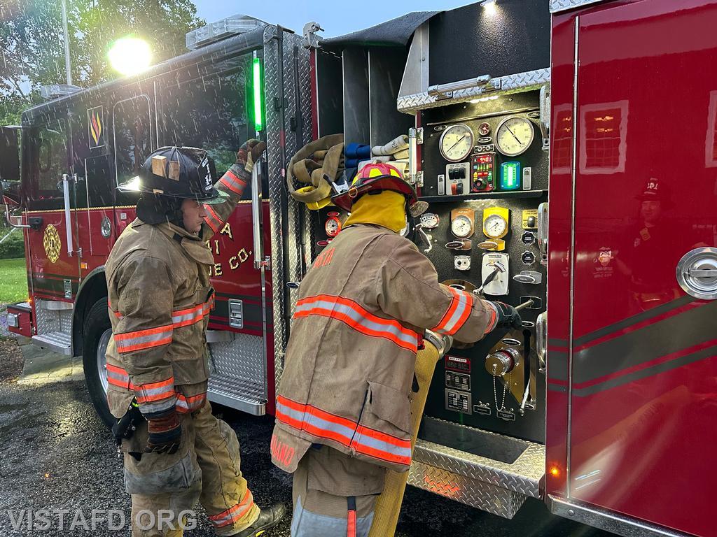 Firefighter Sean Kelly and Lt. Dan Castelhano operating the Engine 141 pump panel - 06/16/25