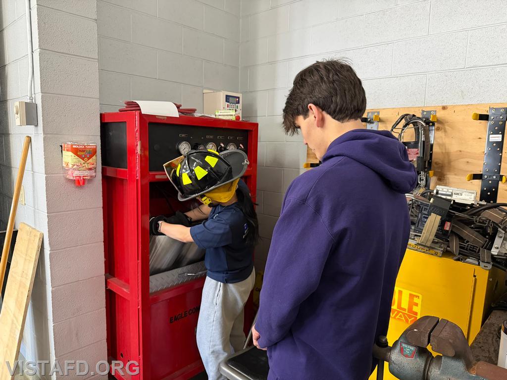 Firefighter/EMT Ashtin Rama overseeing Probationary Firefighter/EMT Candidate Hanna Zhao filling SCBA cylinders - 02/01/26