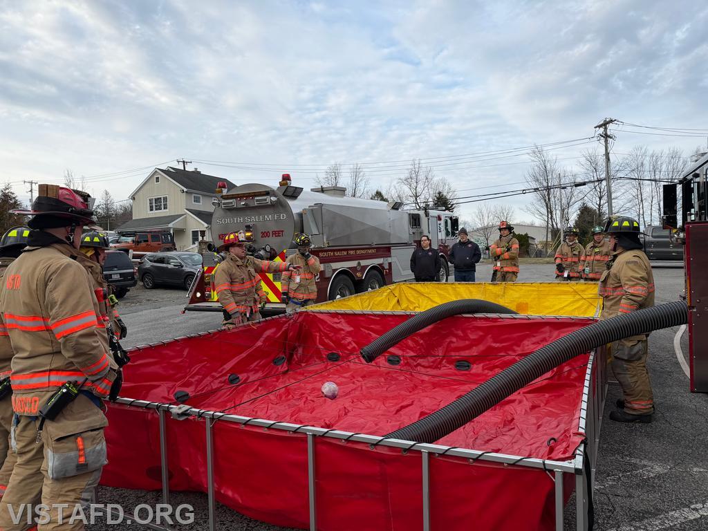 Captain Brian Porco reviewing the tanker shuttle training scenario with members - 03/15/26