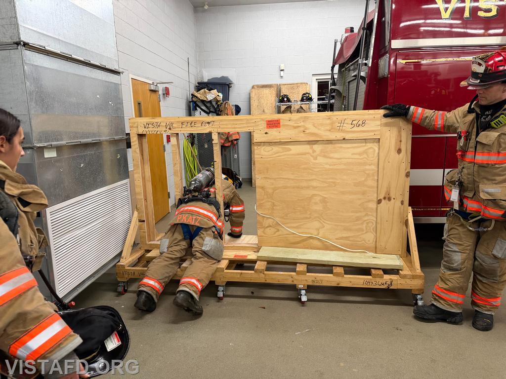Firefighter Phil Katz practicing the wall-breach low-profile maneuver &ndash; 03/23/26