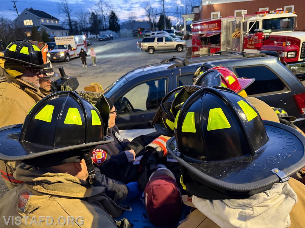 Vista Fire Department personnel transferring the patient to a stretcher following extrication - 04/06/26