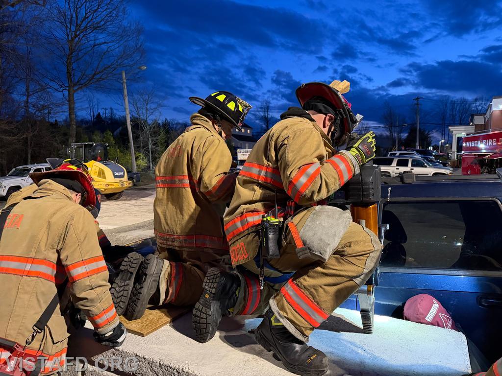 Vista Fire Department personnel coordinating patient removal during extrication operations - 04/06/26