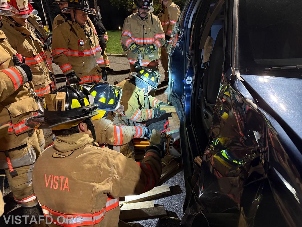 Vista Fire Department personnel performing vehicle stabilization during extrication operations - 04/06/26