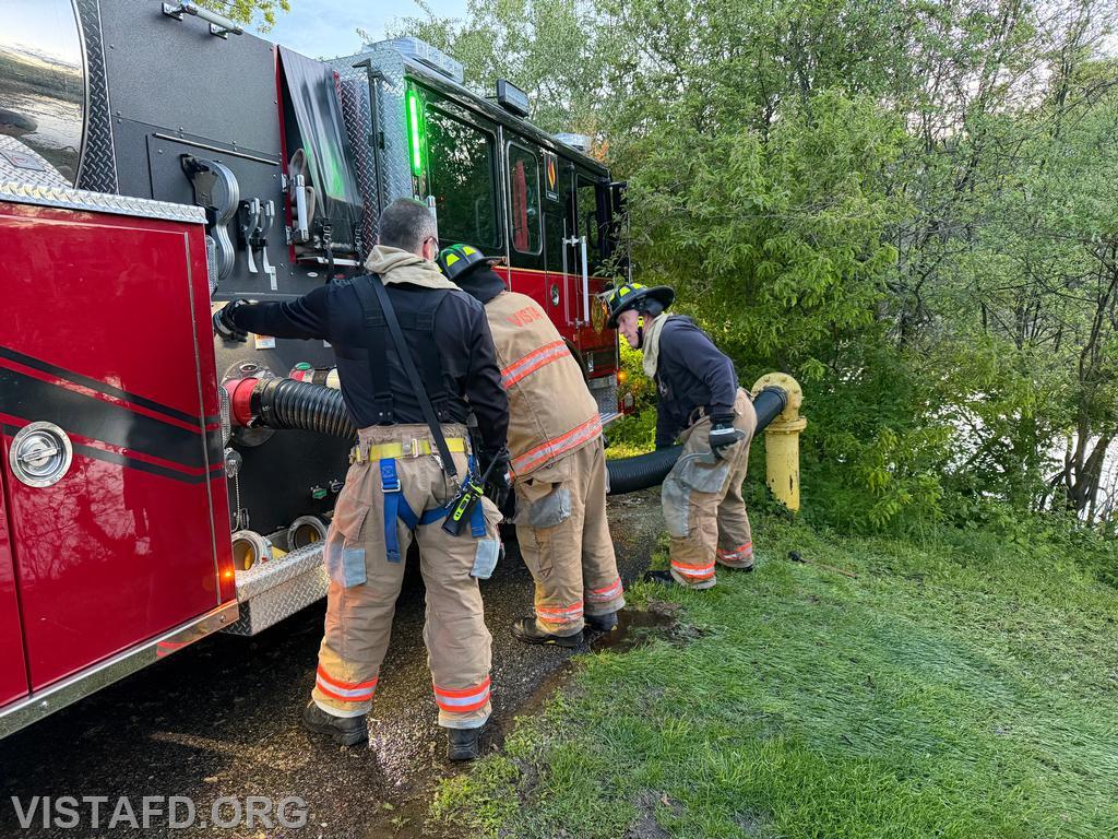 Captain Brian Porco, Foreman Pietro Cipriano, and Foreman Dan Hochman connecting Tanker 4 to one of the Oakridge Drive dry hydrants - 05/11/26