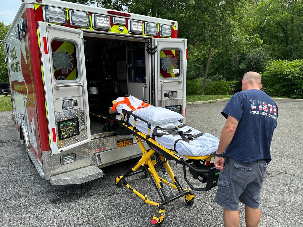 Probationary Firefighter Phil Wanderman practicing how to use the stretcher on Ambulance 84B1 - 06/23/24