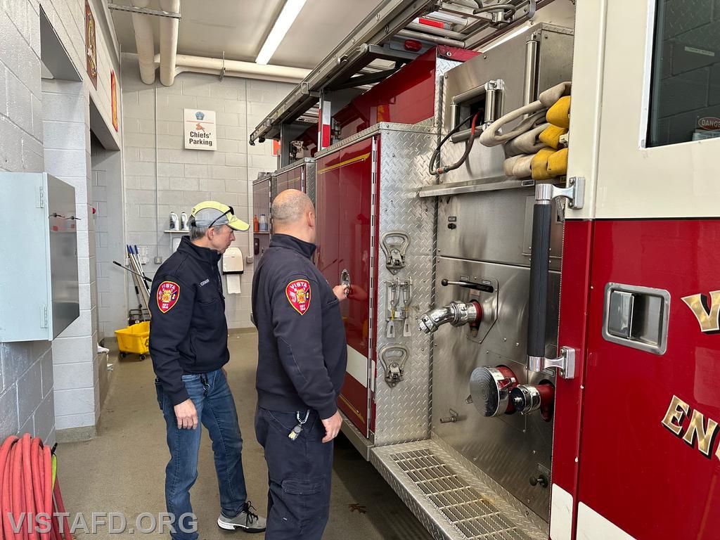 Lt. Dan Castelhano and FF/EMT Candidate Andy Korman doing a walk around check of Engine 143 before conducting driver training - 01/14/24