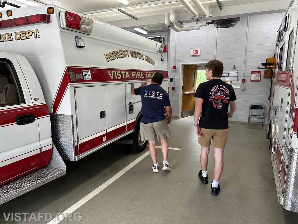 Firefighter Martin Rojas going over the &quot;walk around&quot; ambulance drivers do before going out for a call with Probationary Firefighter Ty Graygor - 07/07/24