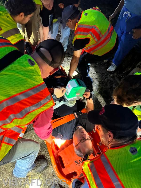 Vista Fire Department personnel working on extricating the patient out of the Leon Levy Preserve - 07/08/24