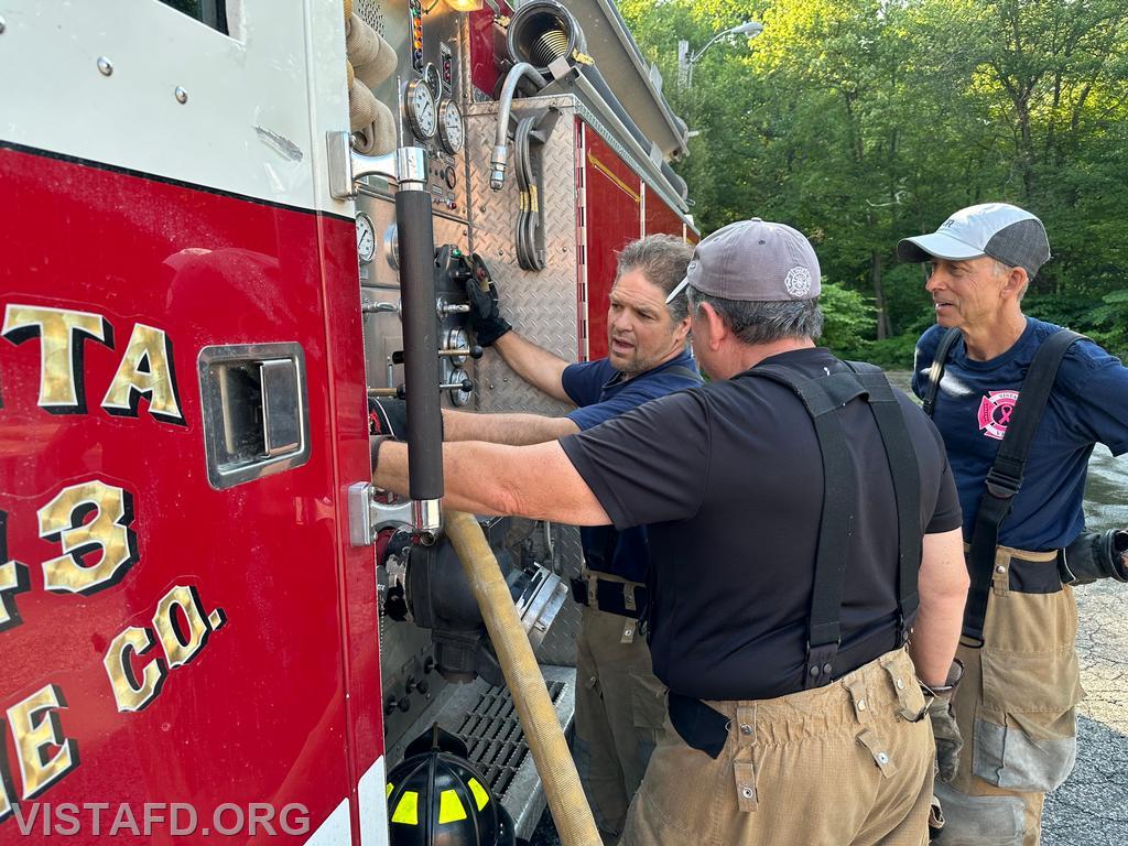 Probationary Firefighter Peter Cipriano practicing how to use the Engine 143 pump panel as Foreman Brian Sferra and FF/EMT Andy Korman look on - 07/14/24