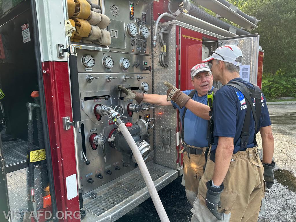 Foreman Brian Sferra going over how to operate the Engine 143 pump panel with FF/EMT Andy Korman - 07/21/24