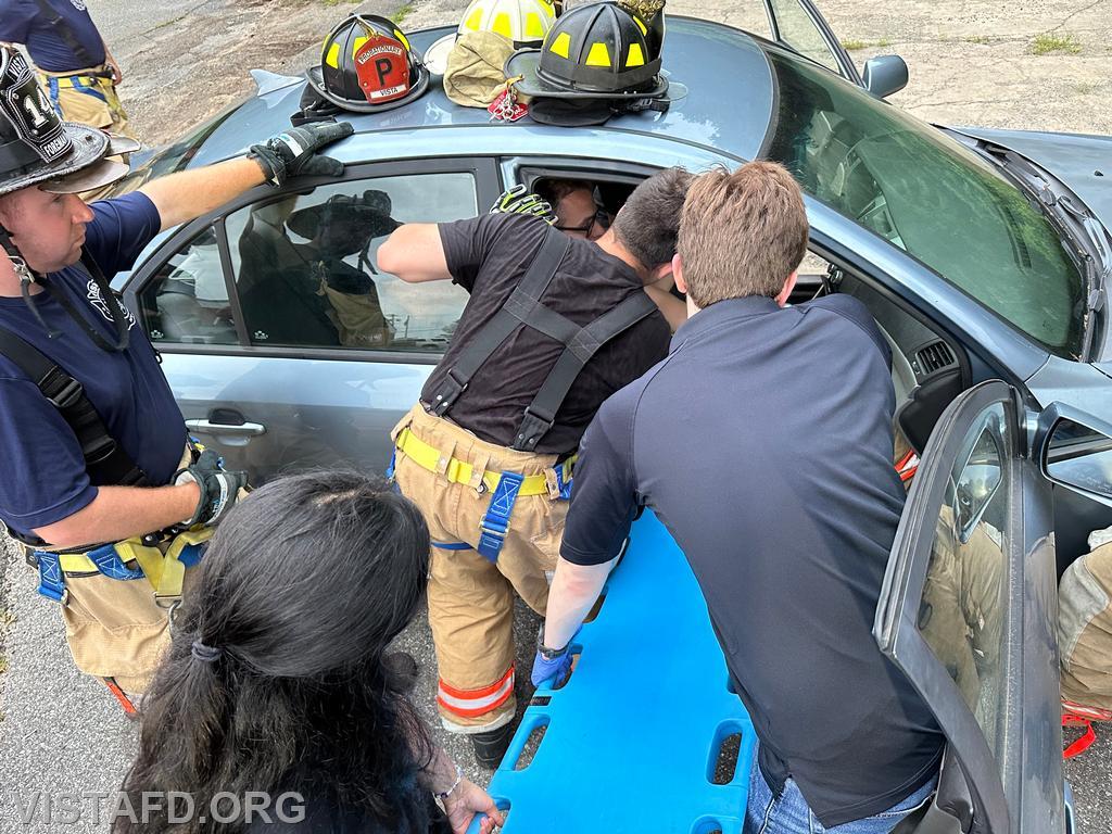 Vista Fire Department personnel practicing patient removal during a motor vehicle accident scenario - 07/22/24