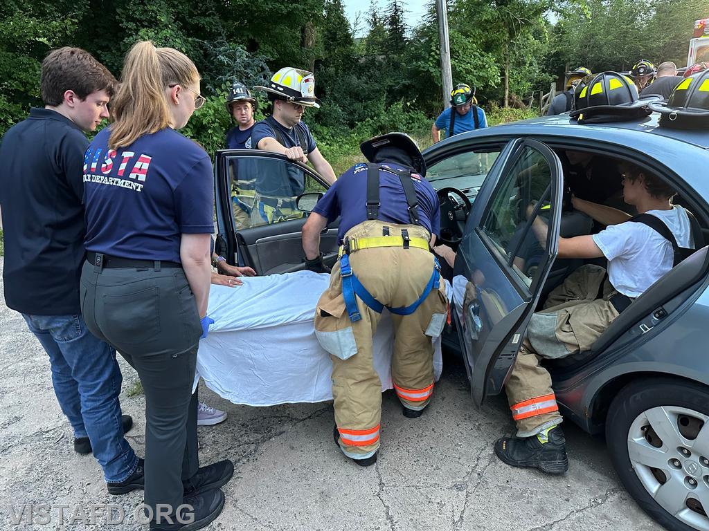 Vista Fire Department personnel practicing patient removal during a motor vehicle accident scenario - 07/22/24