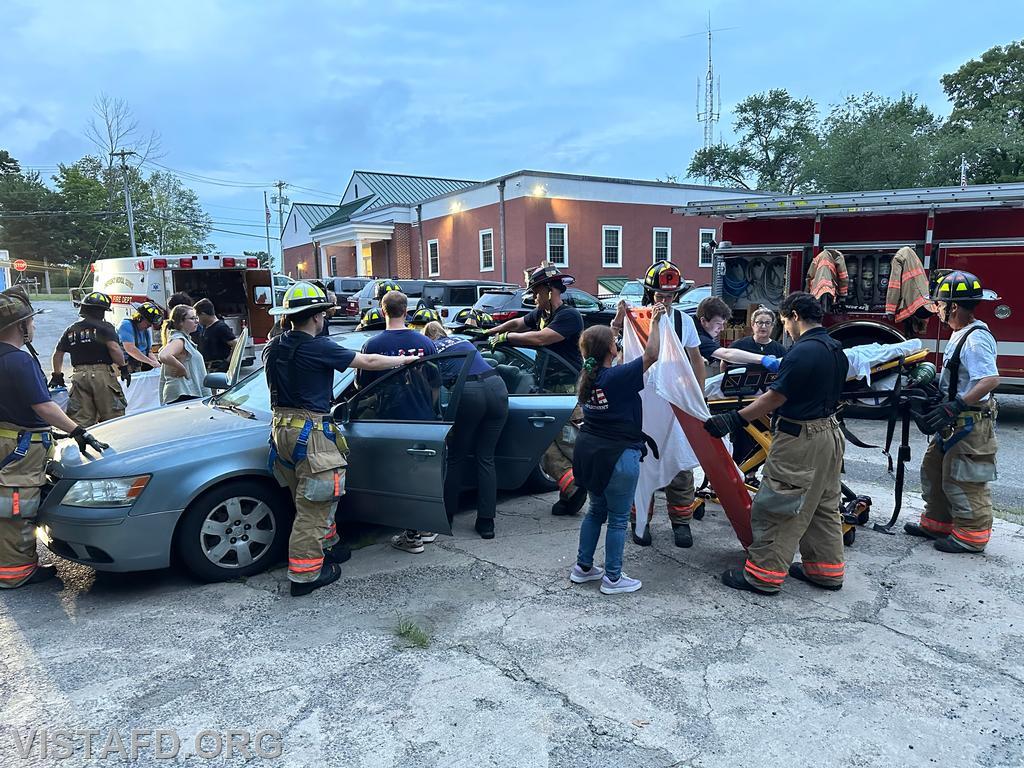 Vista Fire Department personnel practicing patient removal during a motor vehicle accident scenario - 07/22/24