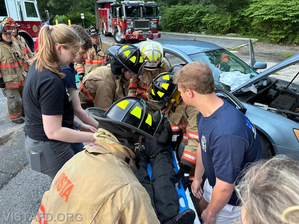Vista Fire Department personnel practicing patient removal during a motor vehicle accident scenario - 07/29/24