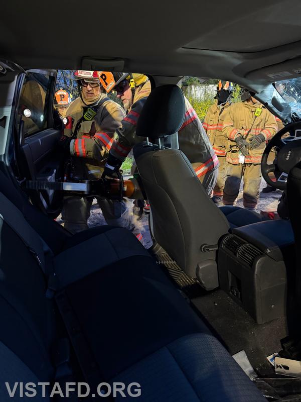 Probationary Firefighter Jared Richardson operates the hydraulic spreaders during the &ldquo;Extrication with Victim Removal &ndash; Doors and Dash Displacement&rdquo; drill &ndash; 04/20/26