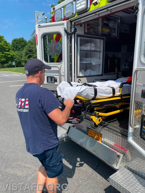 Probationary Firefighter Phil Wanderman going over how to operate the stretcher during driver training - 07/14/24