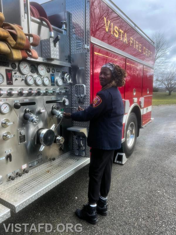 Firefighter Judith Le Gall learning about Engine 142's pump panel - 03/10/24