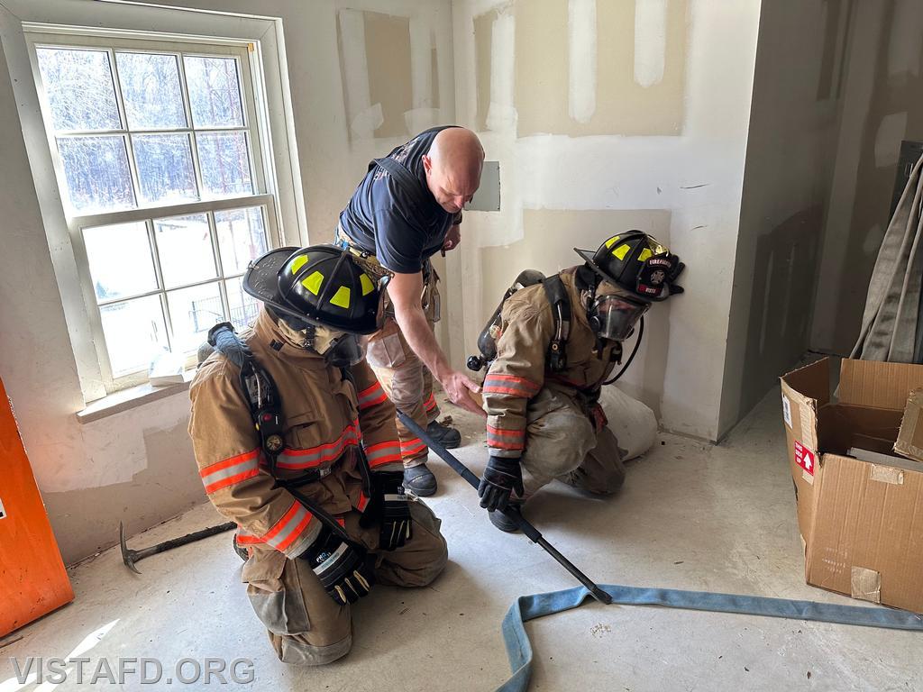 Captain Marc Baiocco reviewing V.E.I.S. (Vent, Enter, Isolate, and Search) procedures during the &quot;Firefighter Skills Class&quot; - 03/09/25