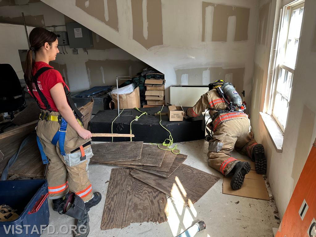 Firefighter Dan Hochman practicing search and rescue operations while Foreman Kyla Whalen observes - 03/09/25