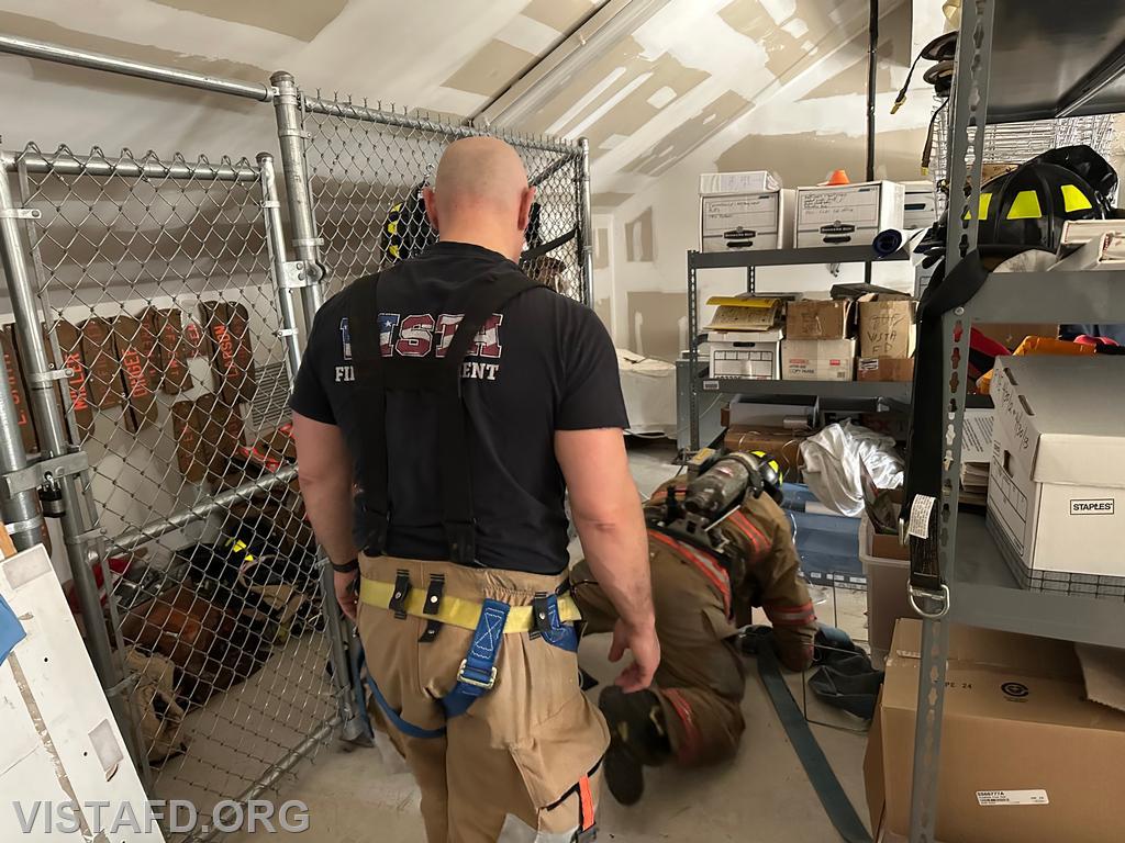 Firefighter Pietro Cipriano practicing search and rescue operations while Captain Marc Baiocco observes - 03/09/25