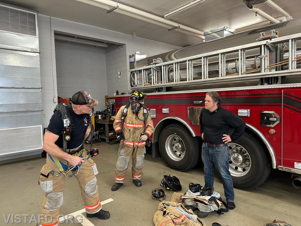 Captain Marc Baiocco demonstrates how to properly put on an SCBA to Firefighter/EMT Candidate Peter Cipriano and Firefighter Dan Hochman - 03/16/25