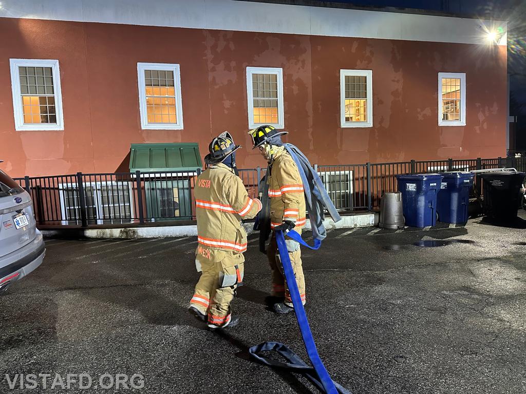Lead Foreman Mike Peck demonstrating hoseline advancement with Probationary Firefighter David Fignar - 03/24/25