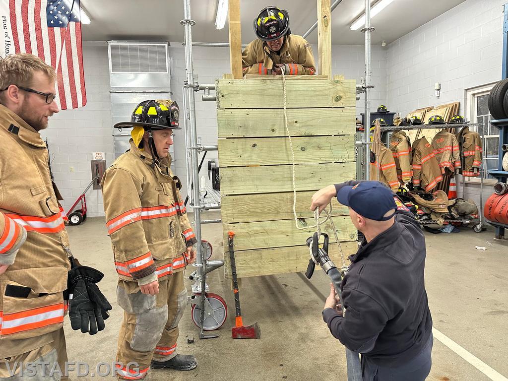 Captain Marc Baiocco demonstrating how to tie a knot on a hoseline during &quot;Firefighter Skills Class - 04/06/25