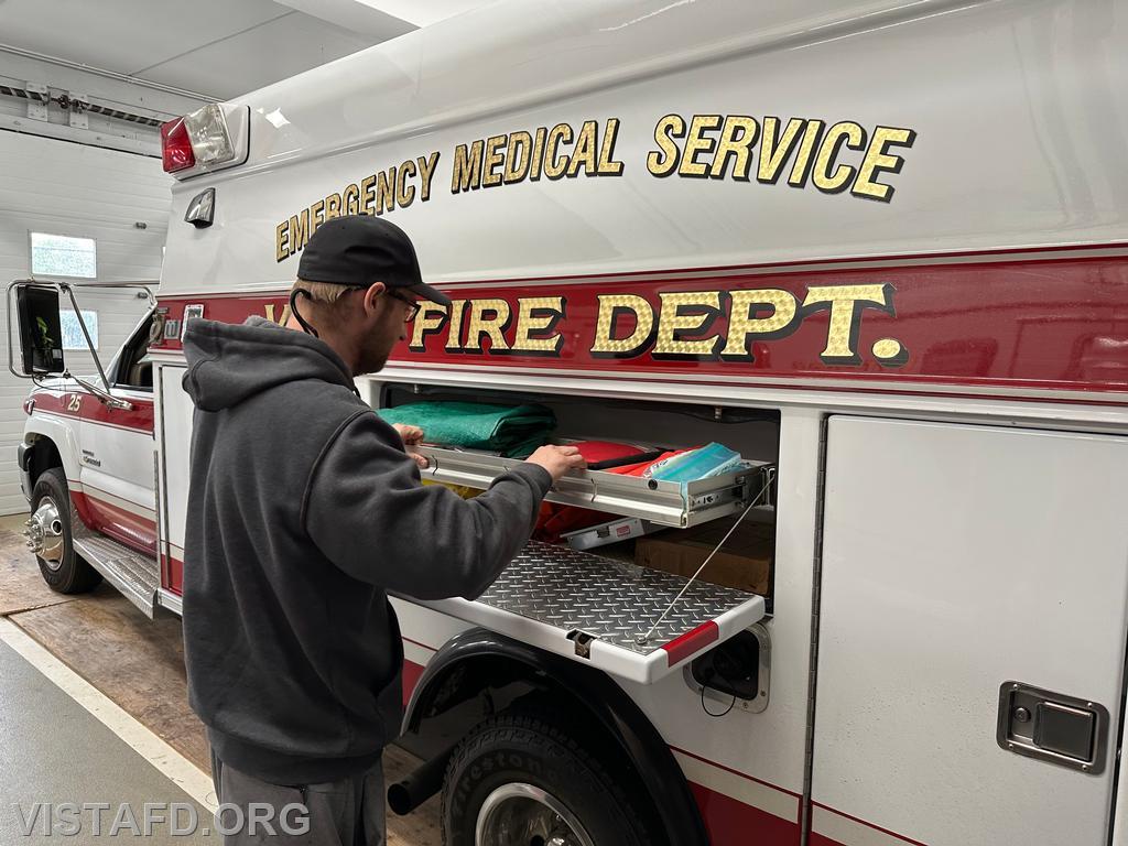 Probationary Firefighter David Fignar reviewing the equipment on Ambulance 84B2 during driver training - 04/06/25