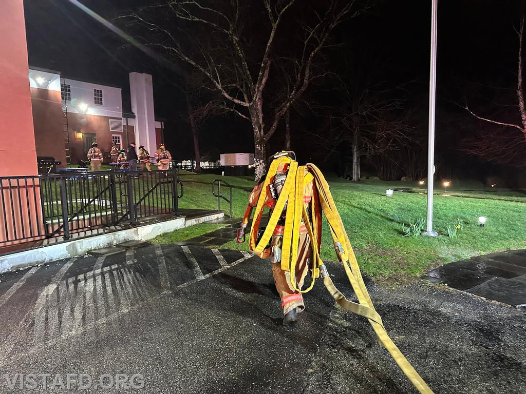 Firefighter Dan Hochman stretching a 1-3/4&quot; hoseline during the &quot;Search and Rescue with Victim Removal&quot; drill - 04/07/25