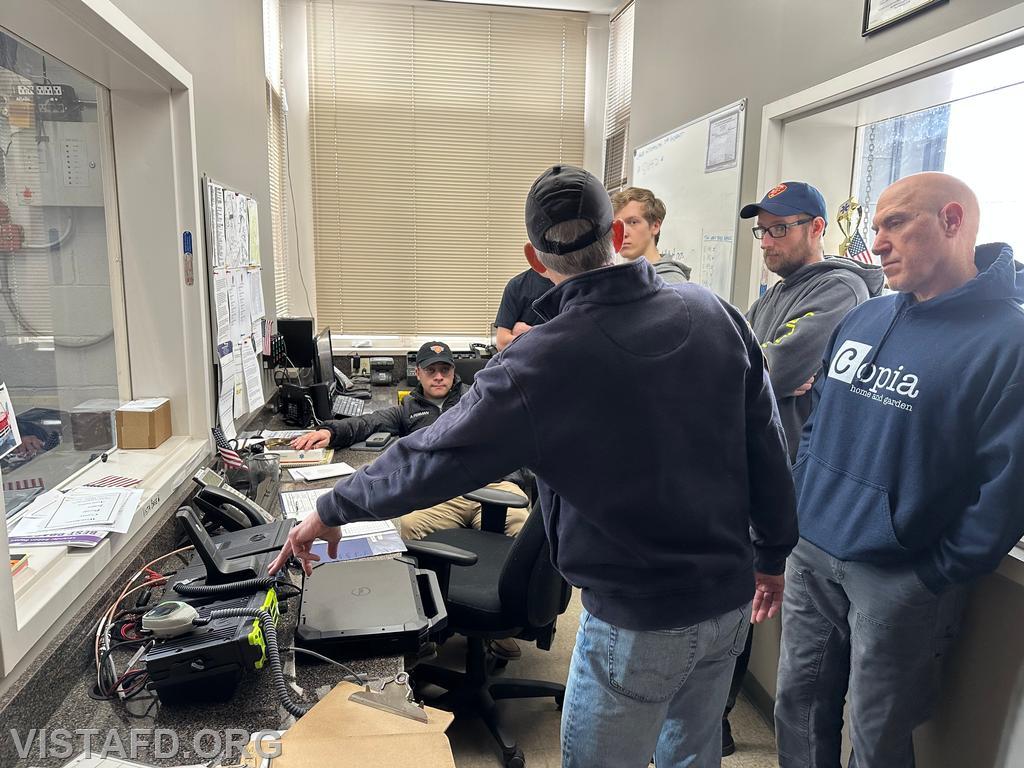 Firefighter/EMT Andy Korman reviews the mobile radios in the Vista Firehouse radio room - 04/13/25