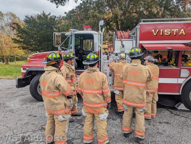 Vista Firefighters learning about the Engine 142 pump panel during &quot;Firefighter Skills Class&quot; - 10/22/23