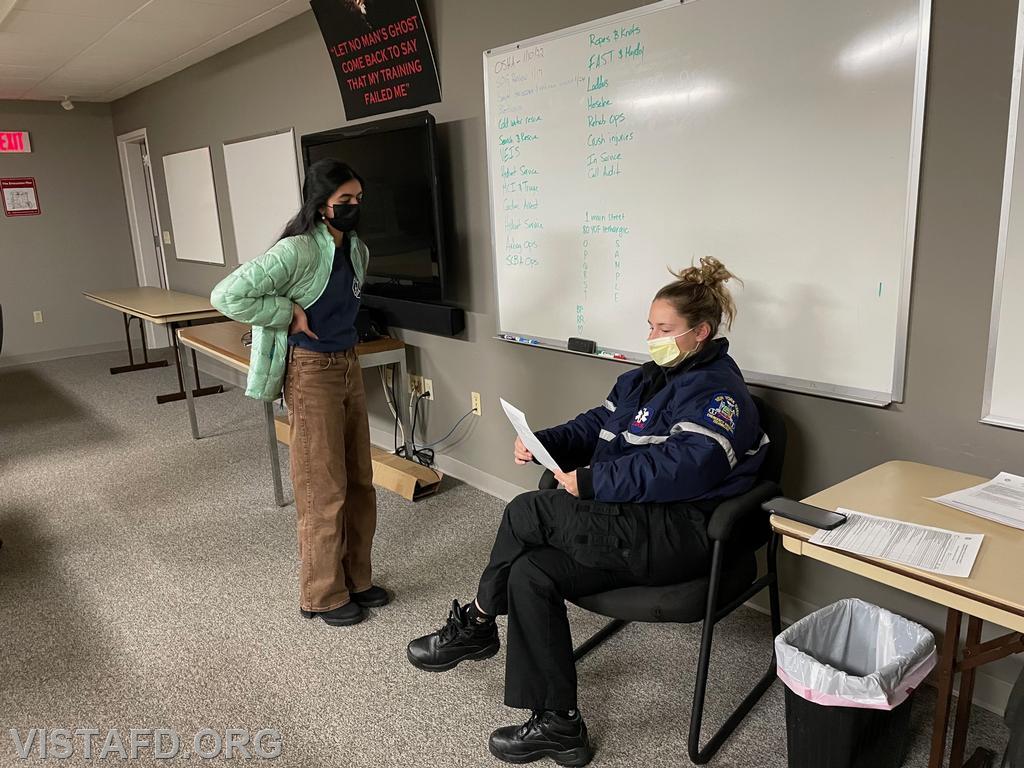Probationary EMT Candidate Savannah Phillips preparing for her National Registry Psychomotor exam with Foreman Elly Hersam