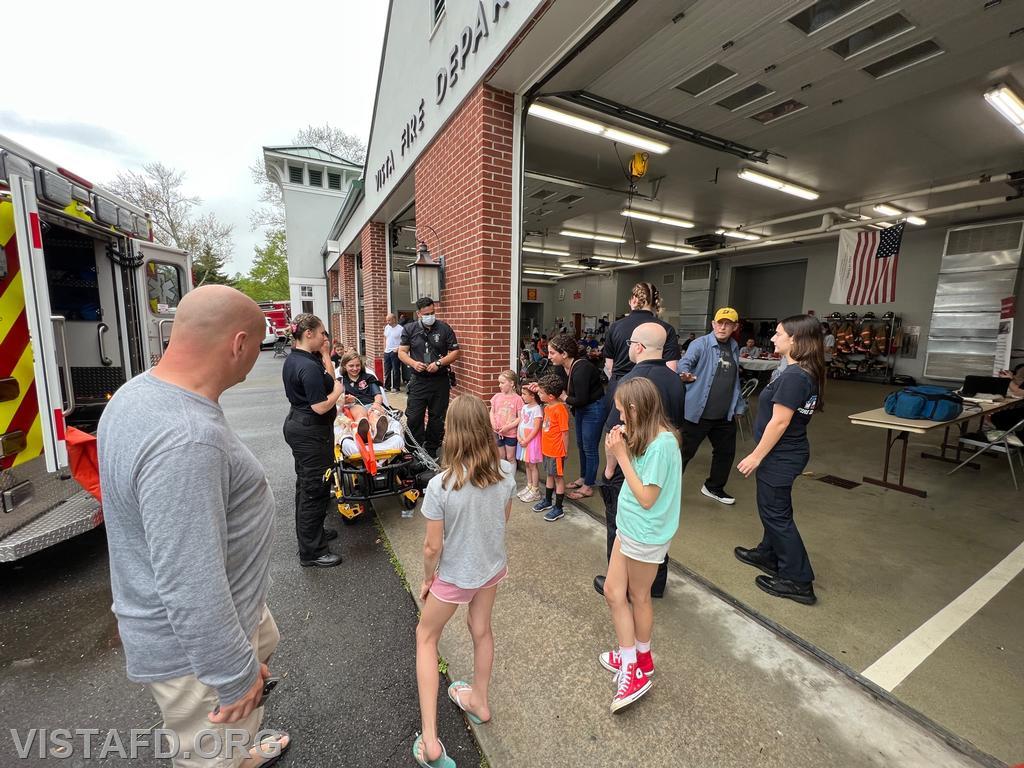 Members of the community watching EMS demos during the "Spaghetti Night and Open House" event