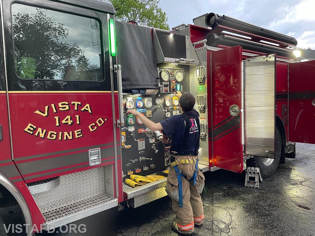 Firefighter Dom Mangone operating the Engine 141 pump panel