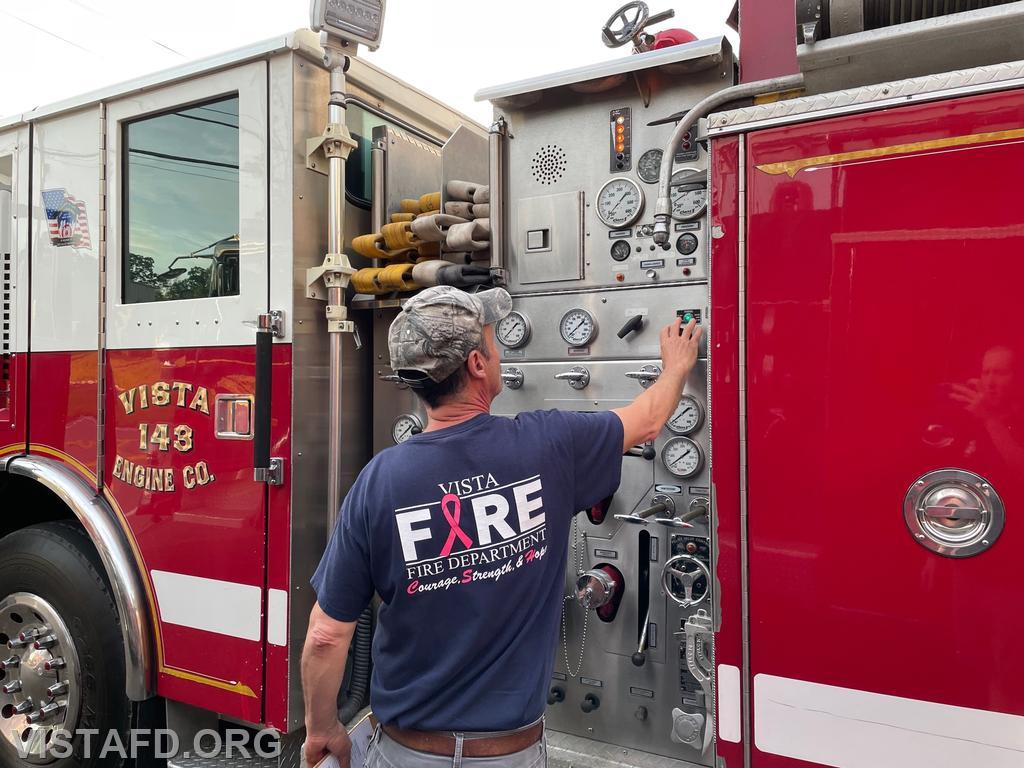 Firefighter Phil Katz checking the pump on Engine 143