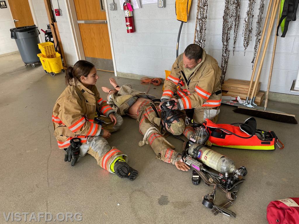 Firefighter Phil Katz and Firefighter/EMT Candidate Kyla Whalen going over F.A.S.T. operations during "Firefighter Skills Class"