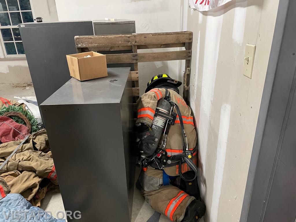 Foreman Ryan Ruggiero conducting firefighter removal techniques