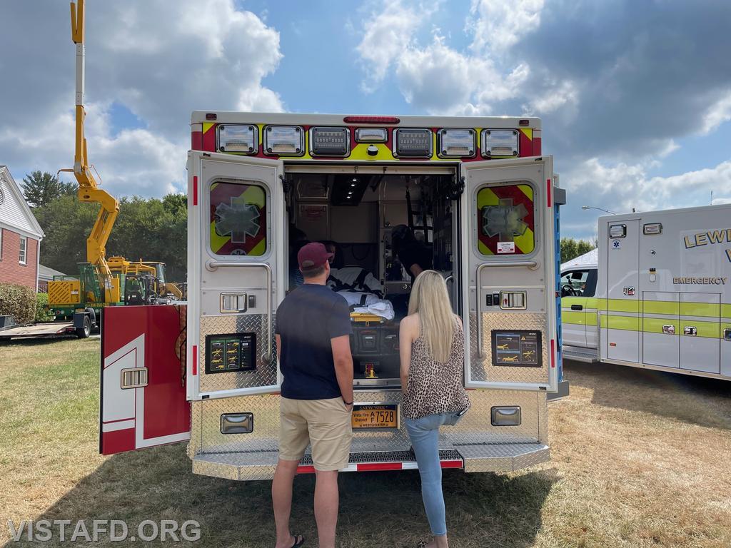 Foreman Isabel Fry and Foreman Ryan Ruggiero giving a tour of Engine 143 during the Kid's Community Club of Lewisboro's Ice Cream Social event