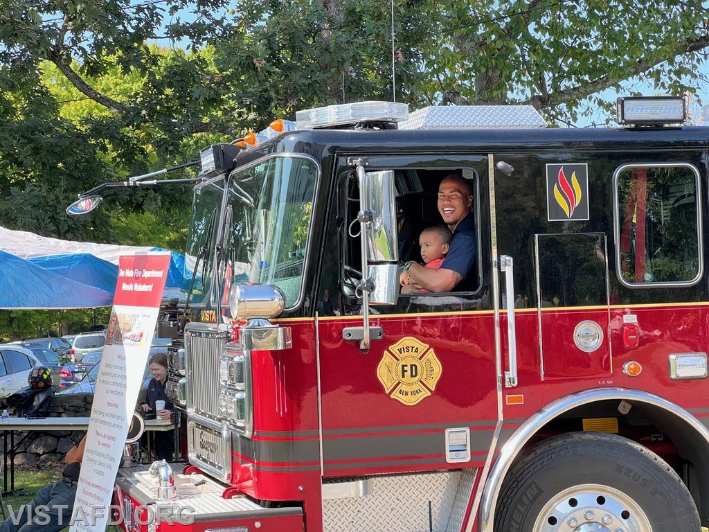 Firefighter Jose Rosa and his son Noah Kai enjoying the South Salem Library Fair