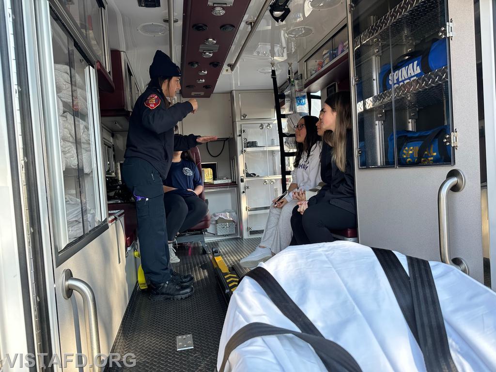 Firefighter/EMT Kyla Whalen giving tours of Ambulance 84B1 to JJHS students