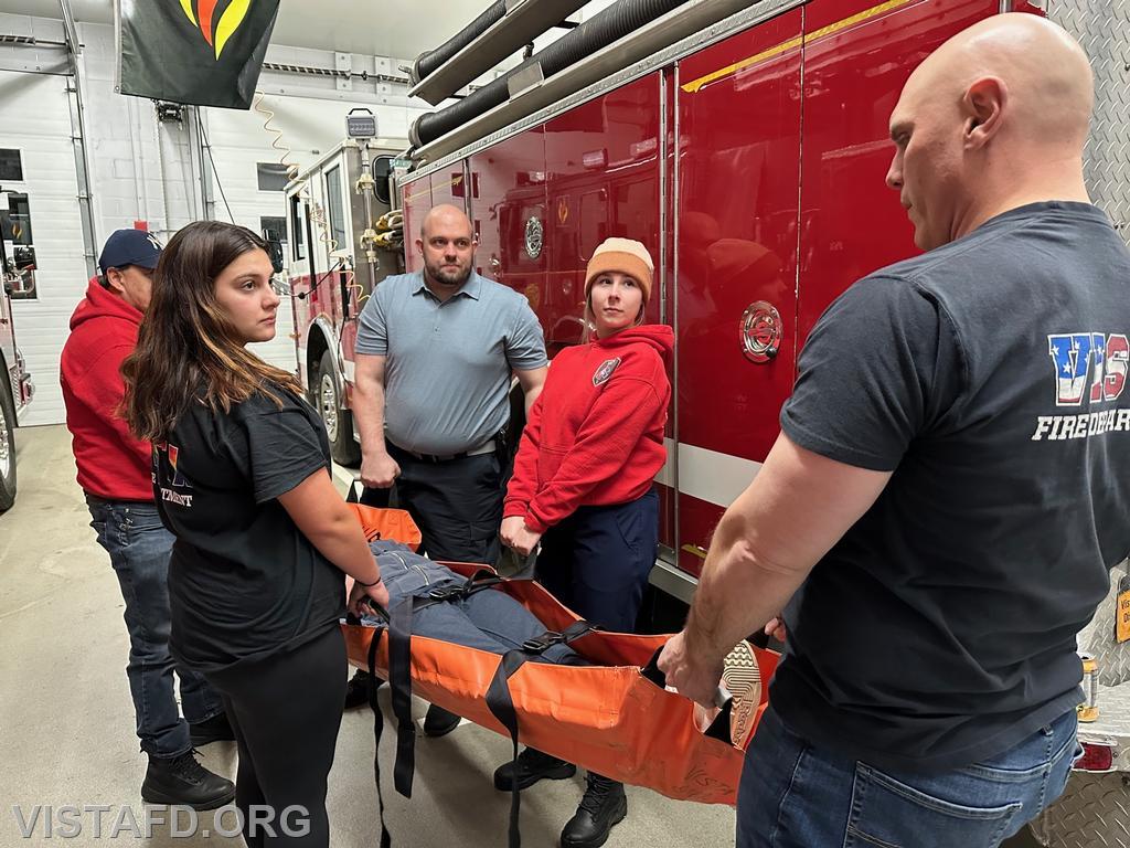 Vista Fire Department personnel operating the reeves stretcher
