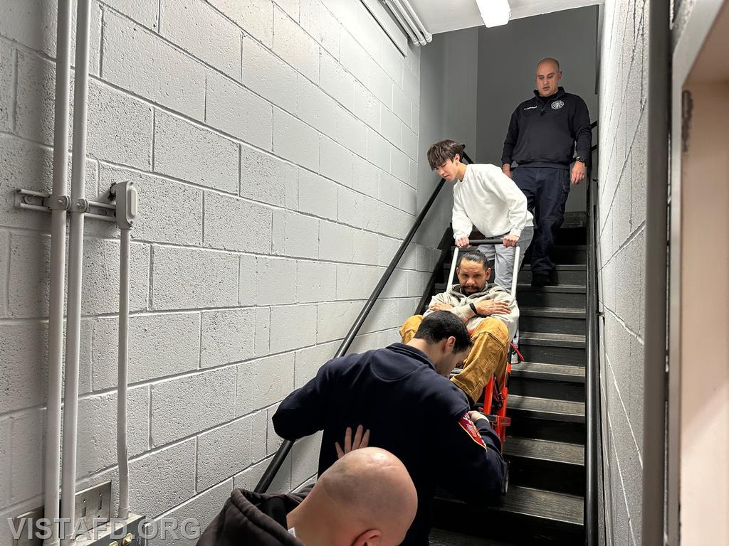 Vista Fire Department personnel operating the stair chair