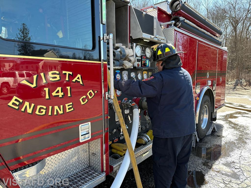 Firefighter/EMT Ryan Huntsman operating the Engine 141 pump panel
