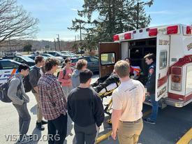 EMT Candidate Ian Ferman and Probationary EMT Grant Vialardi showing how the Ambulance 84B2 stretcher works