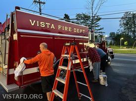 Lt. Dan Castelhano, Ex-Chief Jim Hackett and Firefighter Ron Egloff cleaning Engine 142
