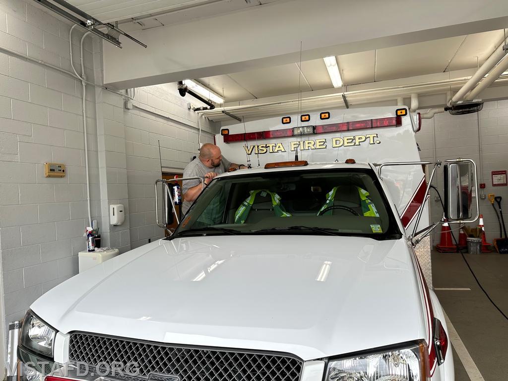 FF/EMT Ryan Huntsman cleaning Ambulance 84B2